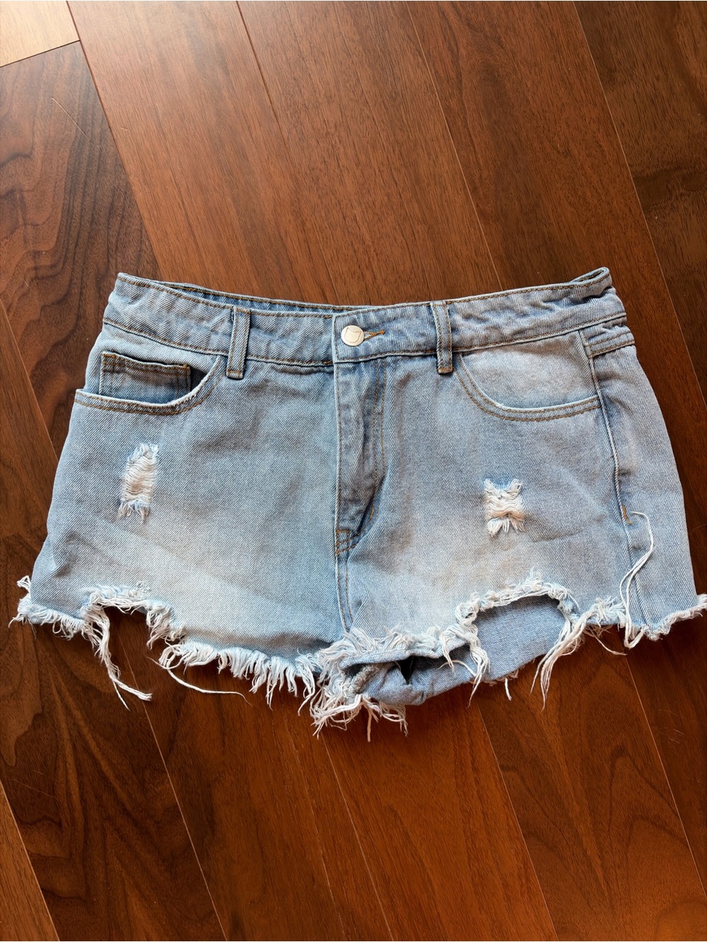 Kittenish Light Blue Distressed Denim Shorts